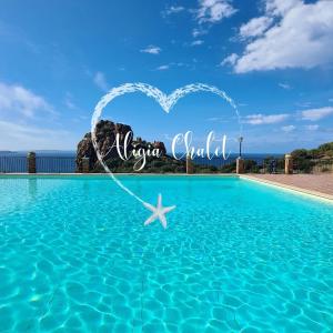 a heart shaped pool with a starfish in the water at Aligia Chalet in Nebida