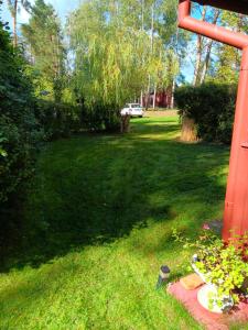Zahrada ubytování Chata Doksy Máchovo jezero + 2 fotografie