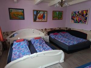 Postel nebo postele na pokoji v ubytování Liána Vendégház