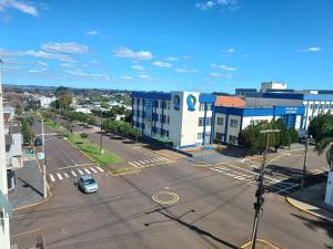 an aerial view of a parking lot in a city at Apart próximo a Unimed, Catedral e HSA com 2 quartos com 2 ARES e garagem in Santo Ângelo