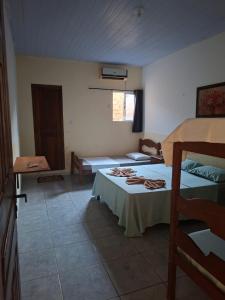 En eller flere senge i et værelse på Pousada Apolónia