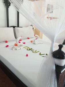 Postel nebo postele na pokoji v ubytování The Dream Garden Bungalow