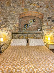 Postel nebo postele na pokoji v ubytování Agriturismo Il Cuscino Nel Pagliaio