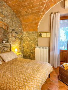 Postel nebo postele na pokoji v ubytování Agriturismo Il Cuscino Nel Pagliaio + 117 fotografií