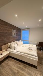 Giường trong phòng chung tại Mühls Apartments