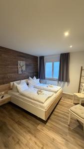 Giường trong phòng chung tại Mühls Apartments +14 ảnh