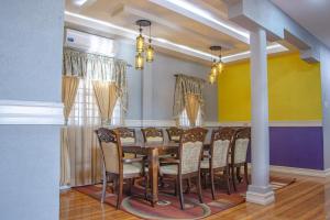 a dining room with a table and chairs at Garden View Villa in Georgetown