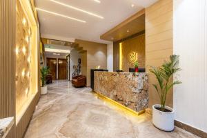 a lobby of a hotel with a marble counter at Hotel MSRegency At Karol Bagh in New Delhi