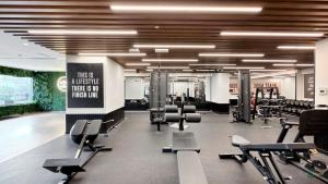 a gym with a lot of chairs and a sign at Spacious & cozy Studio in Downtown! in Sabkhah