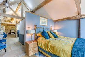 a bedroom with a king sized bed and blue walls at 1 Bed in Wheathill oc-t29765 in Loughton