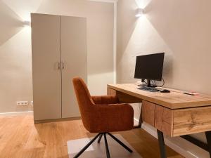 TV a/nebo společenská místnost v ubytování NEU! 90 qm Altstadt Loft - Beste Lage in Passau - Arbeitsplatz - Fitness - Luxus Hotelbetten
