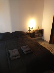 En eller flere senge i et værelse på Moderno departamento en pleno centro de Río Cuarto