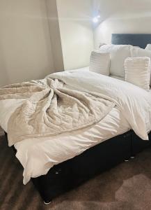 En eller flere senge i et værelse på Budget Rooms in Central Flat