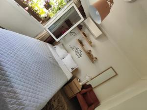 an overhead view of a bedroom with a bed and a window at Margarita's House 2 in Kavála