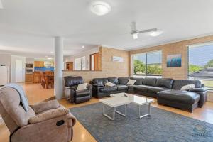 a living room with a couch and a table at Salt and Sand Escape in Lancelin
