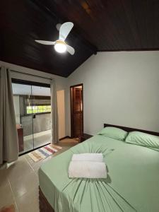 En eller flere senge i et værelse på Suítes Ventos do Mar