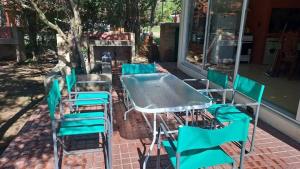 a group of chairs and a table and chairsitures at Bosquesito in Mina Clavero +1 photo