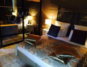 En eller flere senge i et værelse på Villa das Mangas Garden Hotel