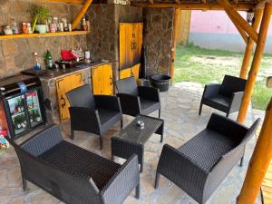 a patio with chairs and tables and a stove at Vilasukovo in Sukovo +4 photos