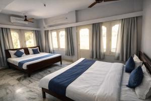 En eller flere senge i et værelse på Ramma TheHotel - 200 mtrs from Nakki Lake