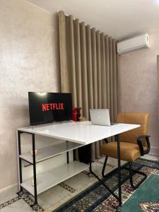 an office desk with a netflix laptop on it at Marrakech Airport in Marrakesh