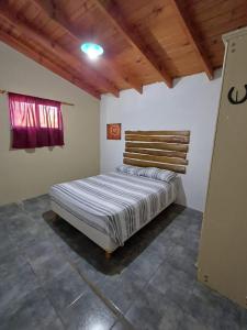 En eller flere senge i et værelse på Cabañas Canaan