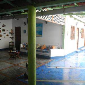 a living room with a couch in a room at Posada Doña Carmen in El Roque +26 photos