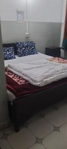 a bed in a room with at Hamala Inn Hotel in Abbottabad +1 photo