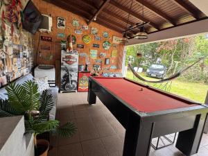 a room with a pool table in a house at Minha Casa Palmas 2 in Governador Celso Ramos