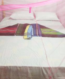 a close up of a bed in a tent at Fr Resort in Arugam Bay