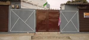 a pair of doors on the side of a building at Khans villa in Hyderabad