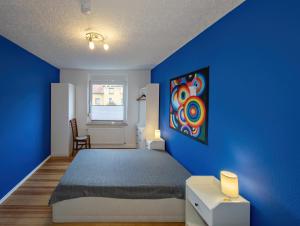 En eller flere senge i et værelse på FeWo beim Schlafhaus