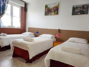 En eller flere senge i et værelse på Bike house Stelvio