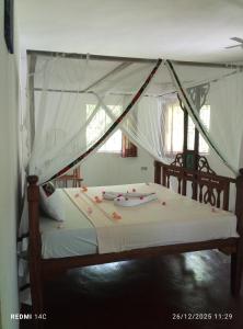 Postel nebo postele na pokoji v ubytování The Dream Garden Bungalow