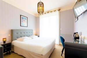 En eller flere senge i et værelse på Best Western Hôtel Brittany La Baule Centre & Plages