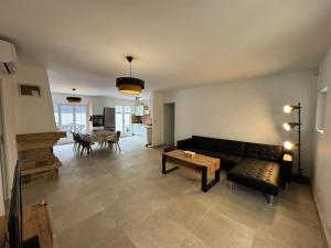 Khu vực ghế ngồi tại Chambre avec salle d'eau et WC privatifs