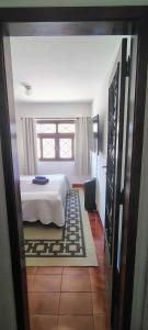 En eller flere senge i et værelse på Arcos das Montanhas