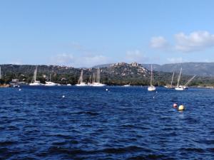 a group of boats in a large body of water at Le Golfe in Figari