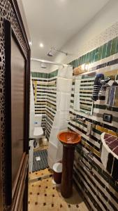 a bathroom with a sink and a toilet in it at Dar Karaouyine Panoramic in Fez +107 photos