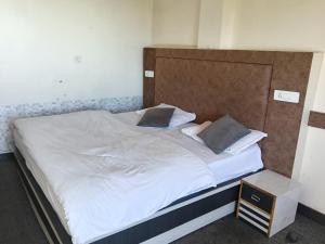 Giường trong phòng chung tại Lekwar Home stay & Restaurant