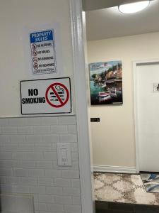 a no smoking sign on a wall in a bathroom at V-Swim Suite-1 in Toronto