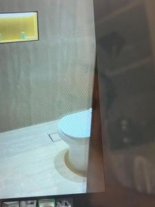a bathroom with a toilet in a room at جده شارع صاري in Jeddah +3 photos