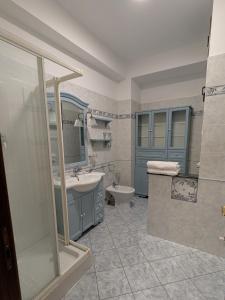 a bathroom with a sink and a toilet at Casa Migliore - con garage privato in Scicli +15 photos