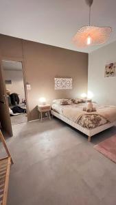 Postel nebo postele na pokoji v ubytování Résidence Jaude - Appartements Cosy en centre ville