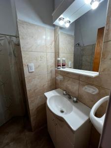 a bathroom with a sink and a mirror at La Soñada in Miramar