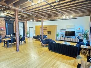 a living room with a couch and a table at Brick City Loft in Newark