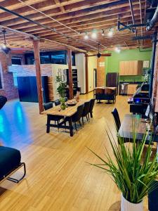 a living room with a table and chairs at Brick City Loft in Newark