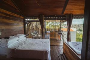 Postel nebo postele na pokoji v ubytování Deck's Chalés Serra da Canastra