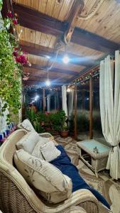 a large wicker bed sitting on a patio at Dolphin Residence Bulgaria in Zgorigrad