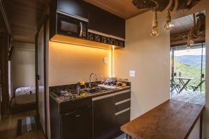 Kuchyň nebo kuchyňský kout v ubytování Deck's Chalés Serra da Canastra + 72 fotografií